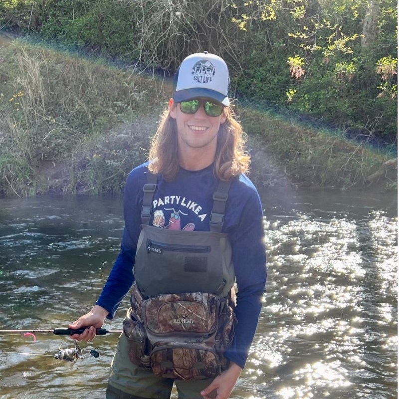 Donny a person riding on the back of a boat in the water